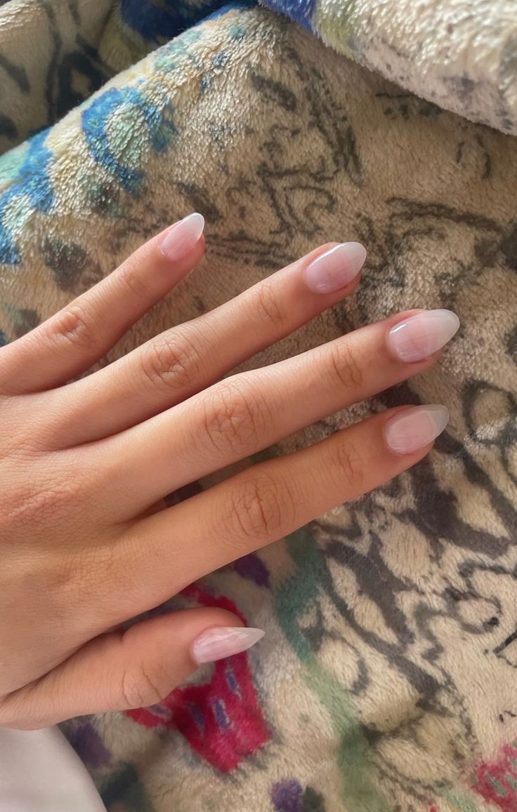 Sophisticated Elegant Almond-Shaped Nails with Soft Pink Ombre and Polished Clear Tips.