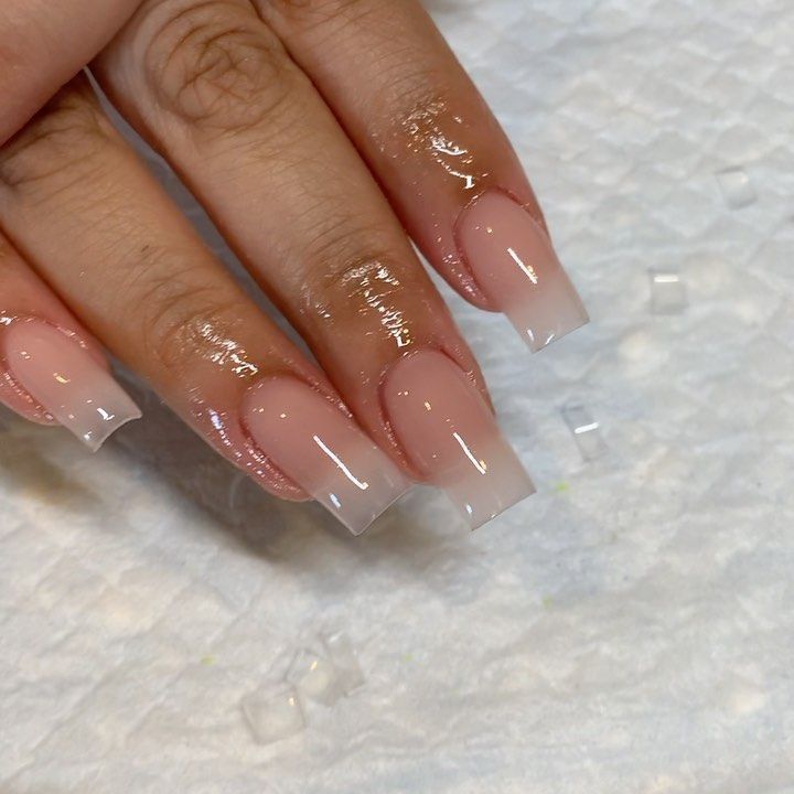 Elegant Ombre Nails: Chic Light Pink to White Transition with Glossy Finish and Minimalist Designs.