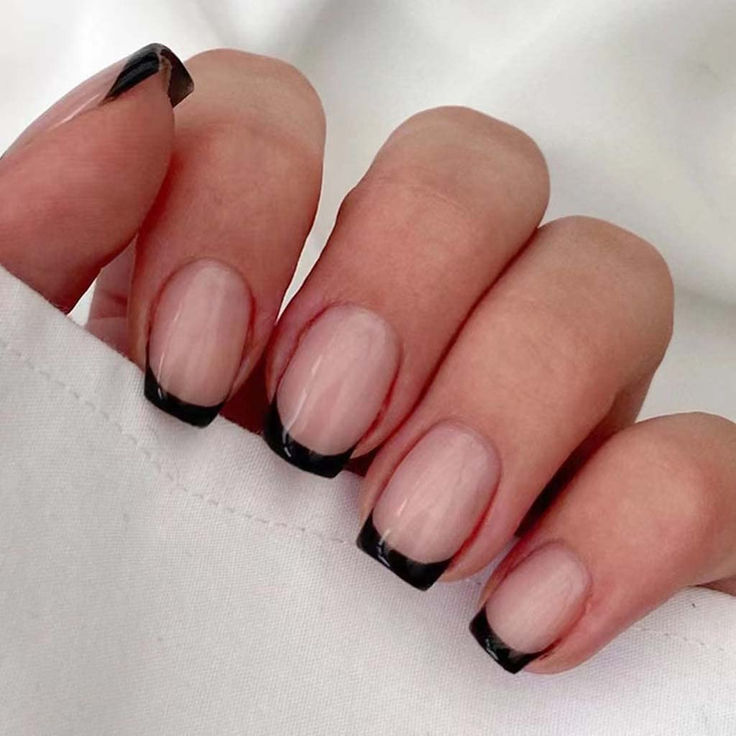 Chic French Manicure with Striking Black Tips: A Sophisticated Twist on Classic Elegance.