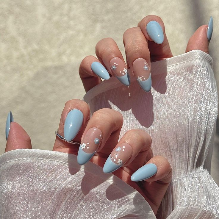 Elegant Pastel Blue Almond-Shaped Nail Design with Floral Accents