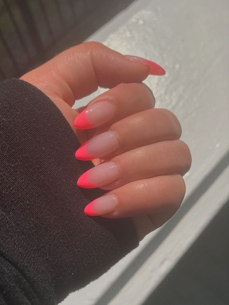 Vibrant Neon Pink Ombre Nails: A Striking Blend of Elegance and Style.