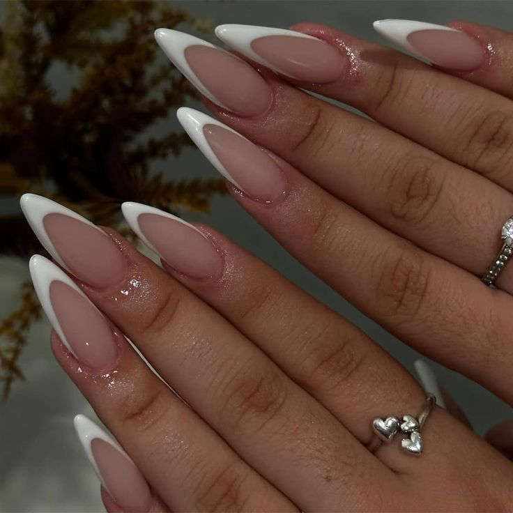 Elegant Almond-Shaped Nails with Sleek Nude and White Polish for a Modern Aesthetic.