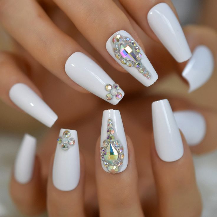 Chic White Nail Art with Rhinestones: A Perfect Blend of Minimalism and Glam.