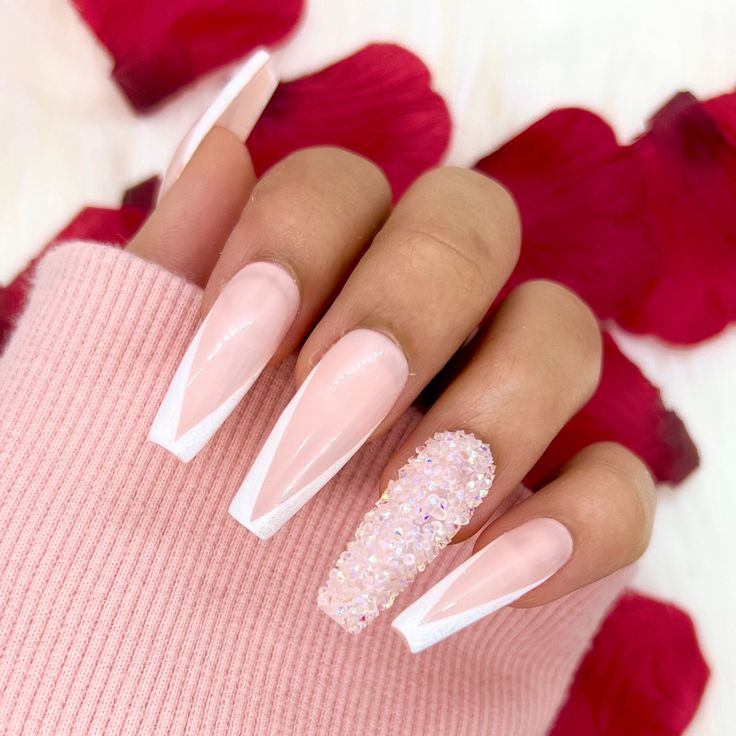 Chic Ombre Nails: Elegant Pink Base with Glamorous White Tips and Iridescent Rhinestone Accent.