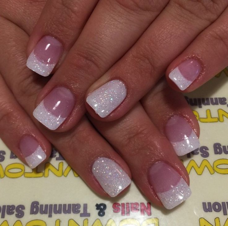 Chic Elegant Nail Design: Soft Pink and White French Tips with Shimmering Finish.