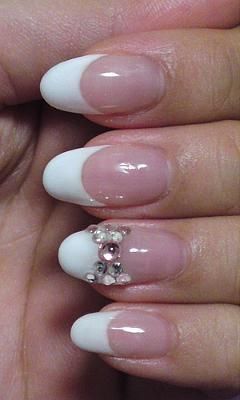 Chic French Tip Nails with Whimsical Bear Design and Rhinestones.