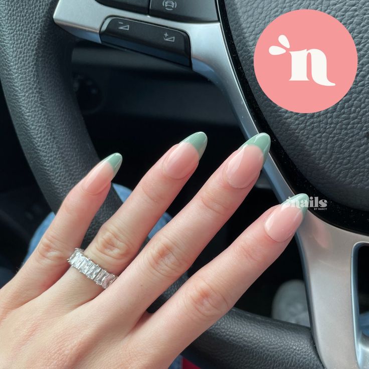 Chic Almond-Shaped Nails: Soft Nude Base with Striking Green Tips