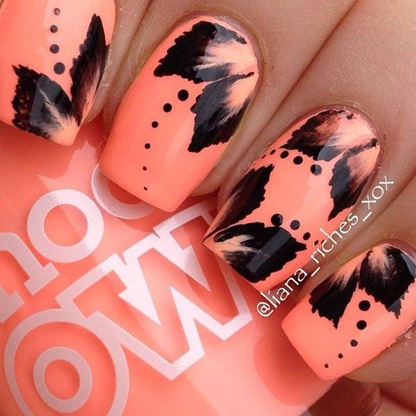 Bold Coral Nail Design with Striking Black Accents and Playful Details