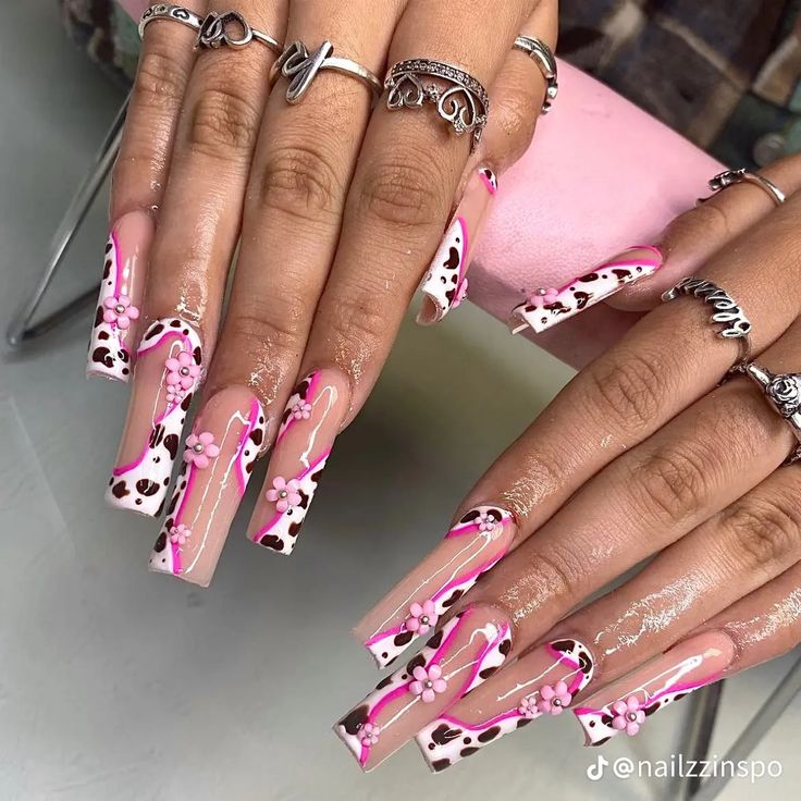 Trendy Long Square Nail Design: Playful Pink and White with Leopard Spots and Floral Accents.