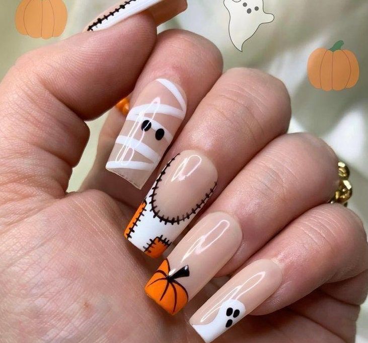 Vibrant Halloween Nail Design with Ghosts, Pumpkins, and Mummies