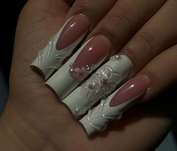 Sophisticated Floral-Inspired Nail Art in Glossy White and Soft Pink Hues.