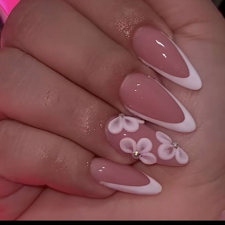 Elegant Soft Pink and White Nail Design with Floral Accents and Rhinestones