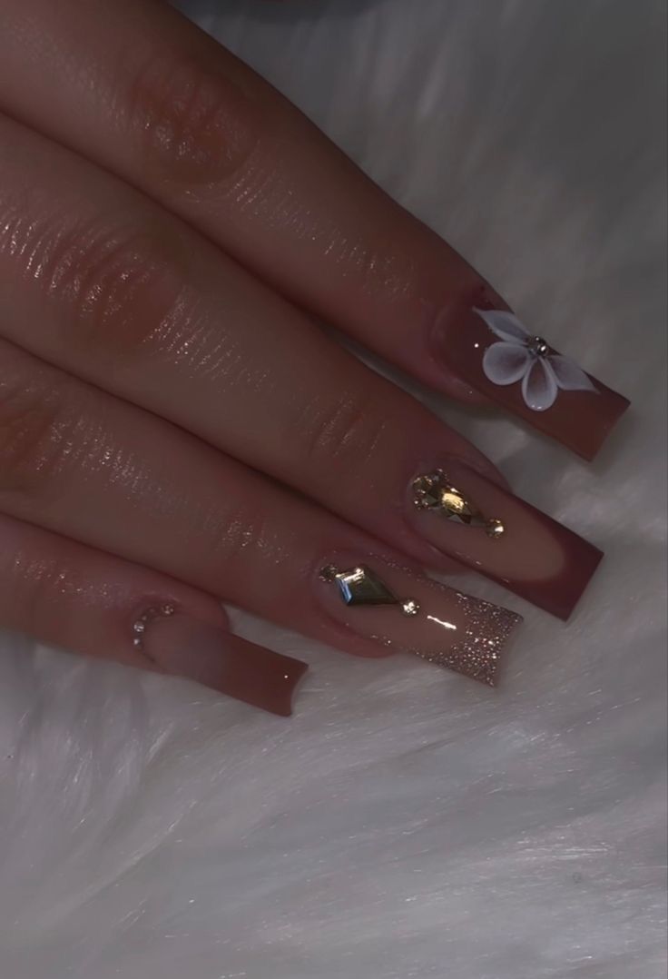 Sophisticated Elegant Nail Design with Nude Tones and Glittery Accents.