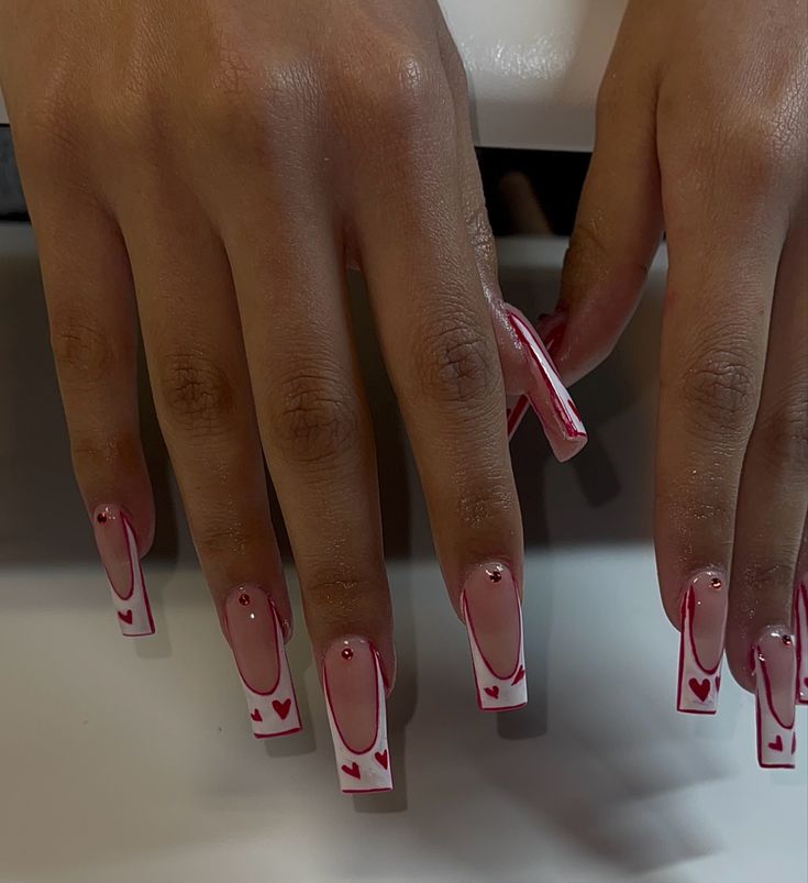 Charming Pink and White Heart Motif Nail Design with Sparkling Rhinestones