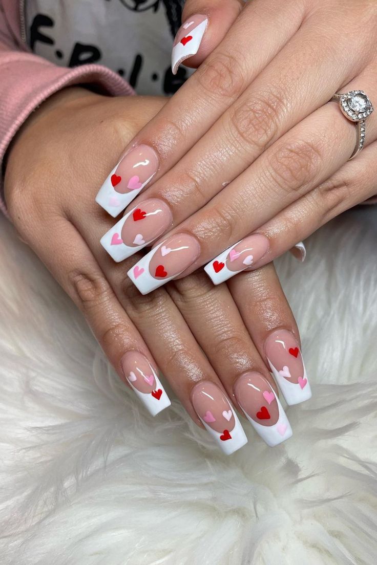 Chic Heart-Themed Nail Design with Modern French Tips in Romantic Colors.