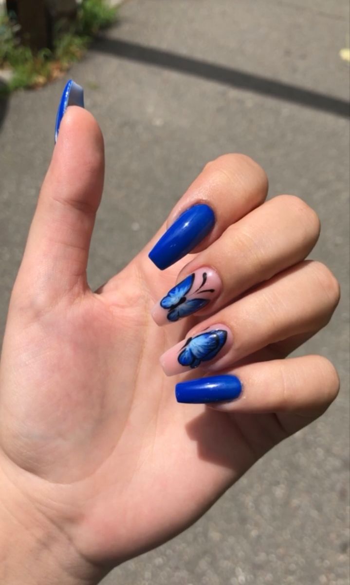 Vibrant Blue Nail Art: Elegant Glossy Finishes and Whimsical Butterfly Accents.