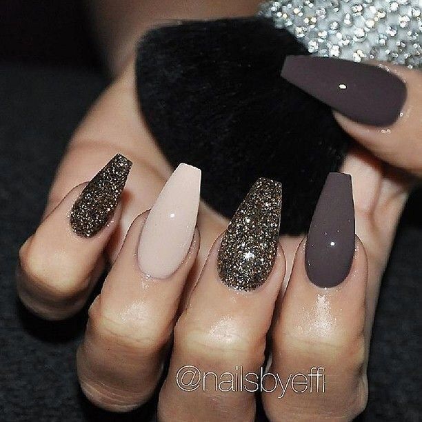 Sophisticated Nail Design: Chic Shapes and Textures in Rich Browns and Glitter Accents.