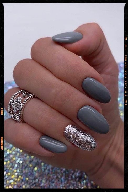 Sleek Matte Gray Nail Design with Glamorous Glitter Accent for Modern Sophistication.