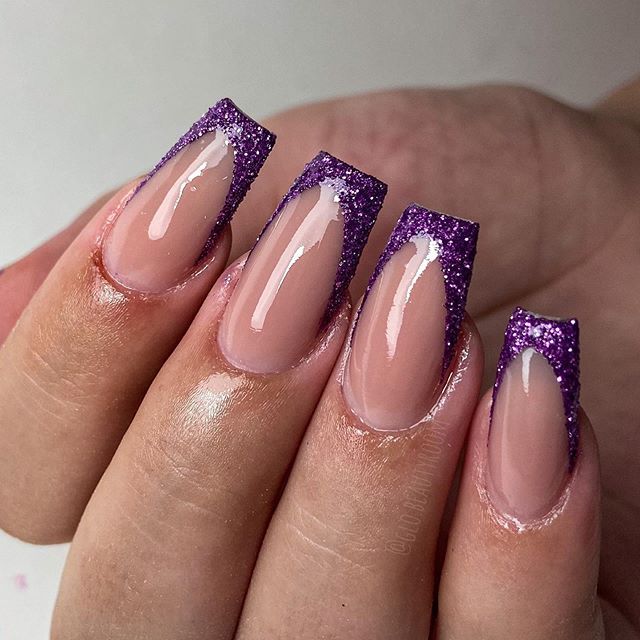 Sophisticated Gradient Purple Glitter Nail Design on Nude Base.