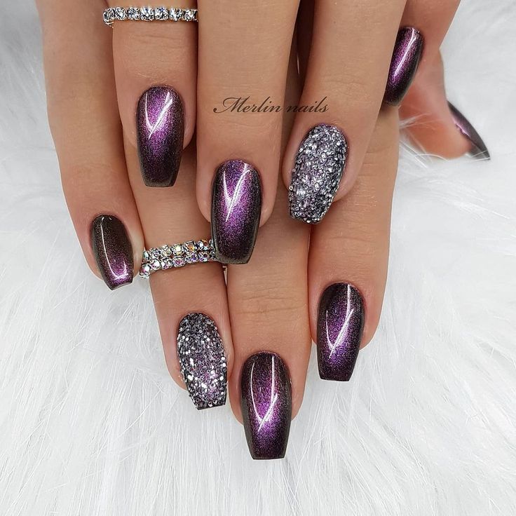 Elegant Dark Purple Gradient Nail Design with Metallic Highlights and Sparkling Accents.