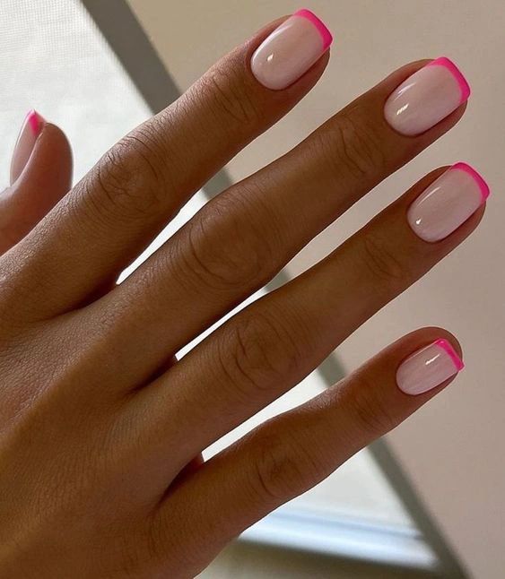 Chic Neon Pink Tip French Manicure: A Fresh Take on Classic Elegance.