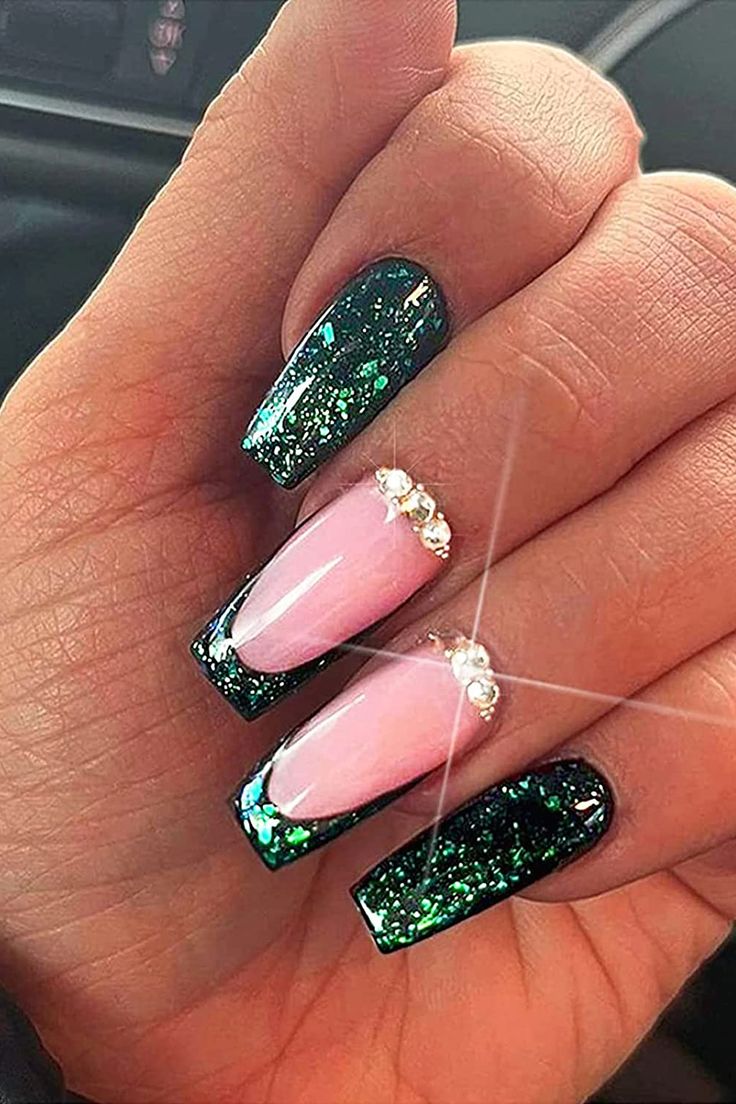 Chic Nail Design: Glamorous Deep Green Sparkle with Soft Pink and Gemstone Accents.