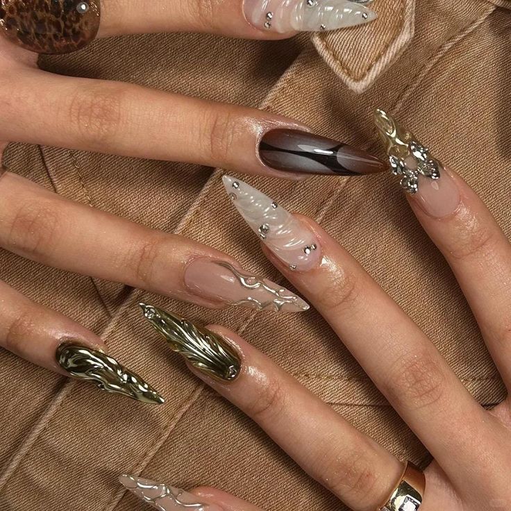 Elegant and Artistic Elongated Nail Design with Textures, Colors, and Metallic Accents