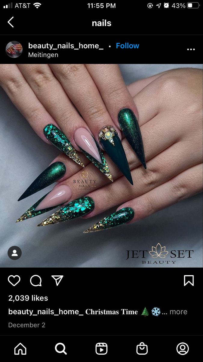 Elegant Stiletto Nail Design with Deep Green and Gold Glitter Gradient.