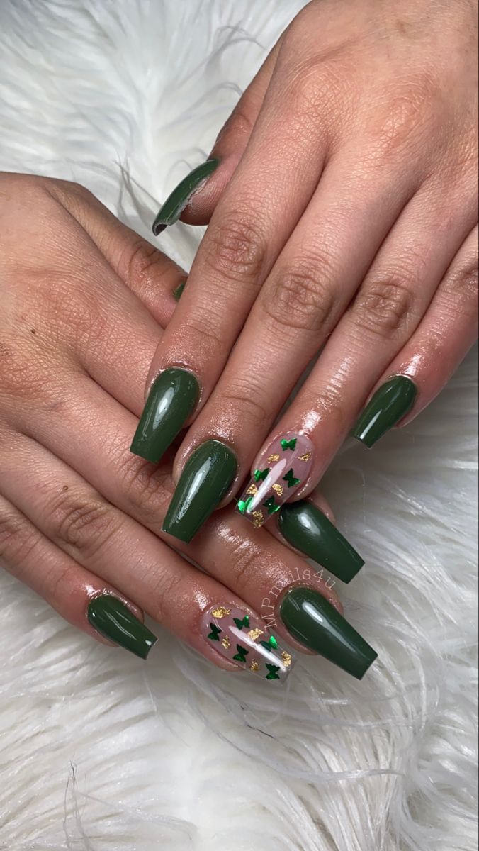 Elegant Green Nails with Decorative Accents: A Striking Blend of Sophistication and Festivity