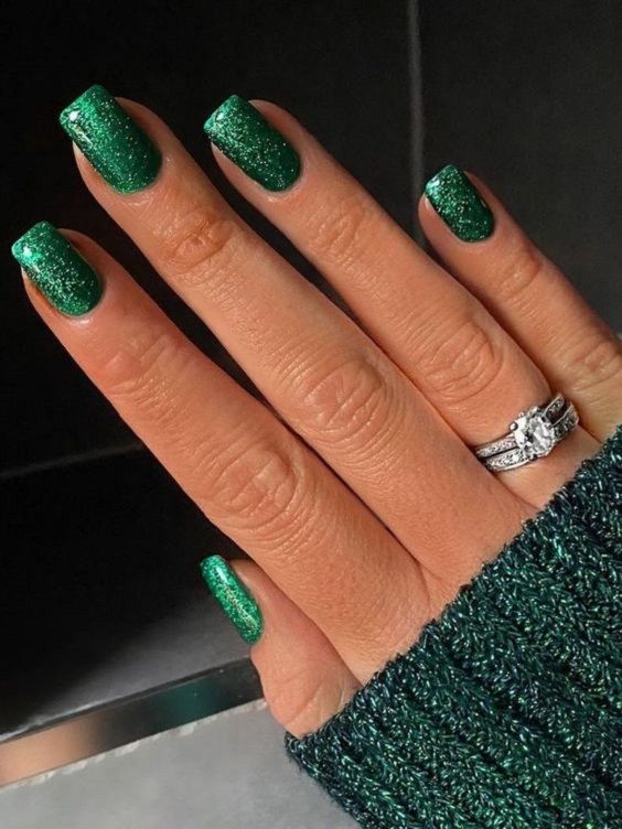 Glamorous Sparkling Green Nail Design for Chic Festive Occasions