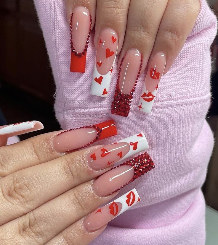 Playful Romantic Nail Design: Red and White Heart Patterns with Sparkle.