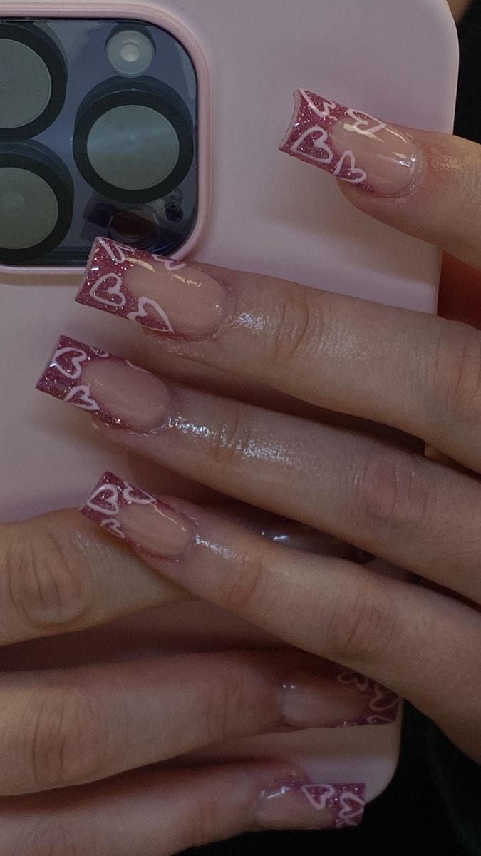 Charming Elongated Pink Nail Design with Heart Outlines and Glossy Finish