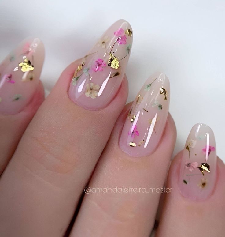 Elegant Floral Nail Design with Gold Accents for a Whimsical Touch.