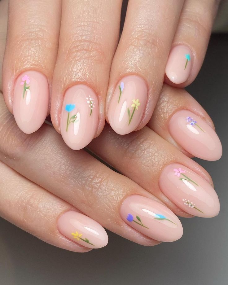 Delicate Floral Nail Design with Pastel Colors for a Whimsical Spring Look.