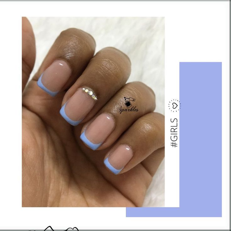 Chic Nail Design: Subtle Nude Base with Soft Blue French Tips and Rhinestone Accents