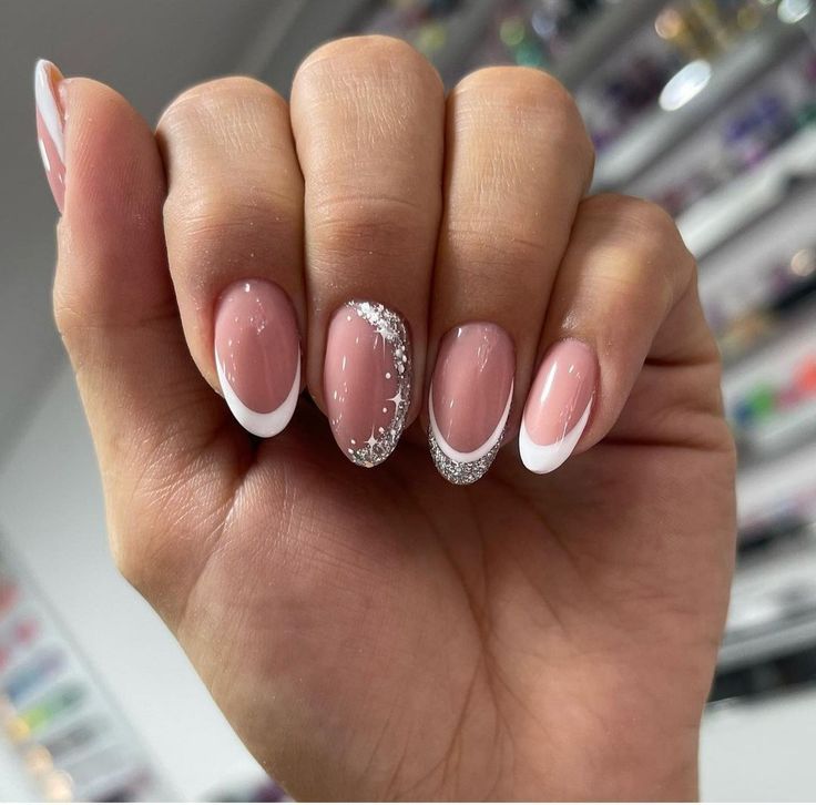 Sophisticated Nail Design: Classic French Tips with Glamorous Silver Accents