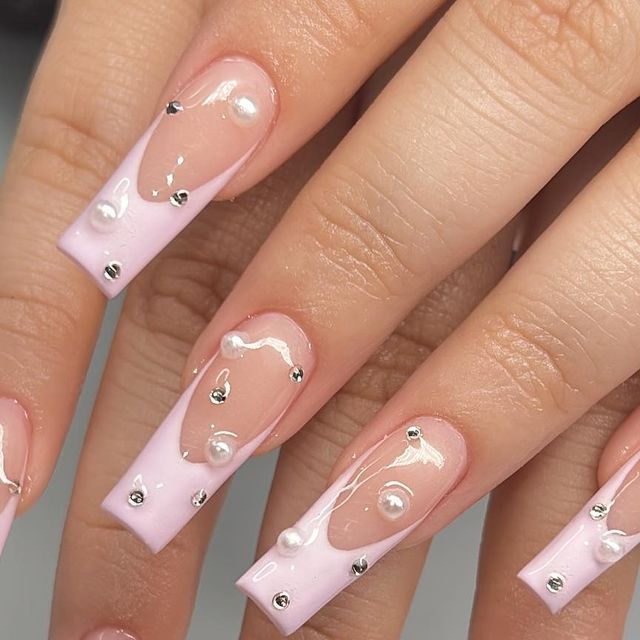 Elegant Glossy Nail Design with Pink Tips, Pearls, and Silver Accents