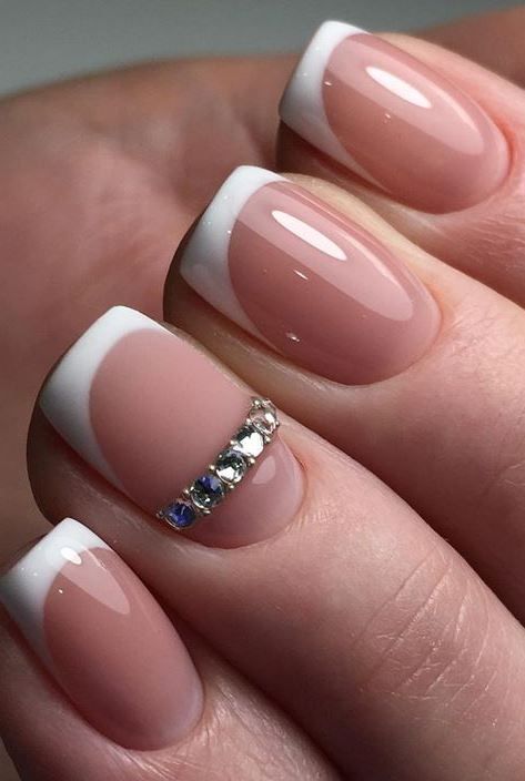 Chic French Tip Manicure with Sparkling Rhinestones for Everyday Elegance.