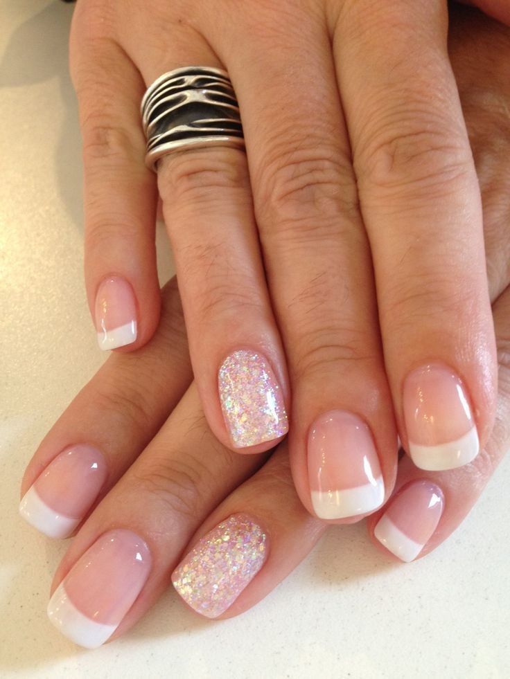 Chic French Manicure with Glamorous Glitter Accent Nail.