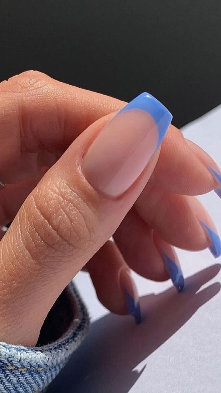 Elegant Blue-Tipped French Manicure: A Modern Twist on Classic Style.