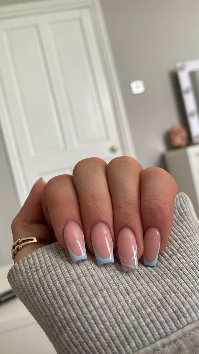 Chic Soft Pink and Light Blue Nail Design with Delicate Geometric Accents.