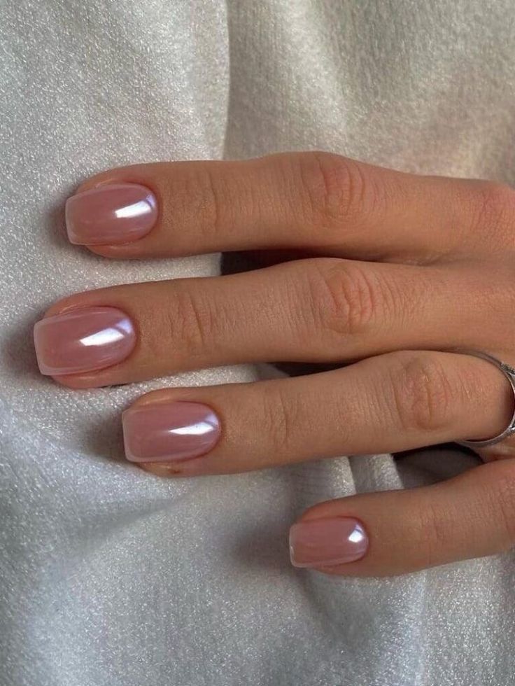 Chic Glossy Nude Nails with Pearlescent Shine for an Understated Look.