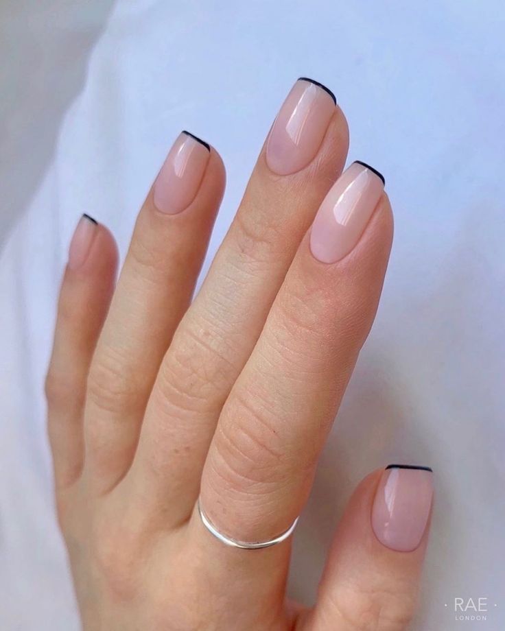 Chic Nude and Black French Manicure: A Modern Take on Timeless Elegance.