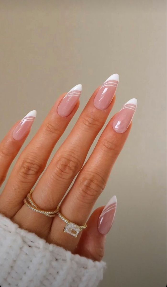 Chic Almond-Shaped Nail Design with Classic French Manicure and Elegant Stripes