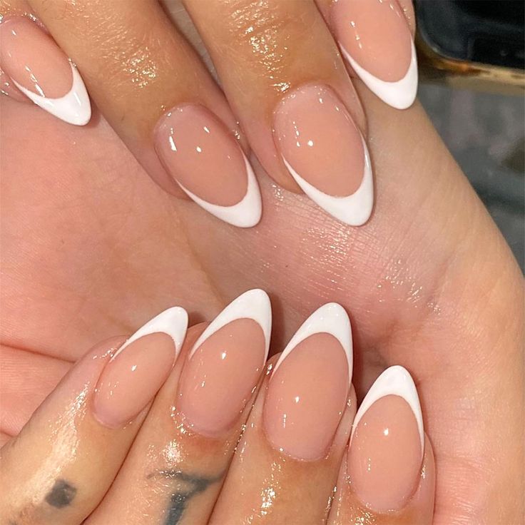 Elegant Almond-Shaped Nails: Chic Nude Base with Striking White Tips