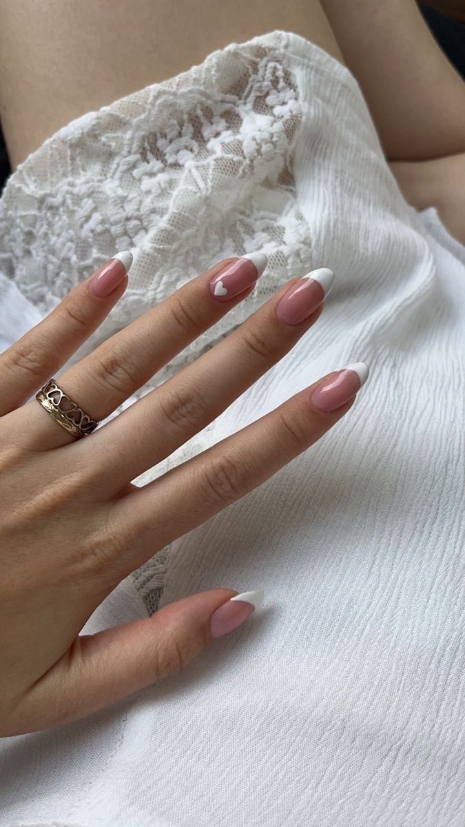 Chic Pink and White Nail Design with Playful Heart Accent