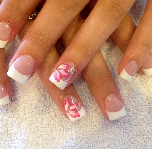 Elegant Pastel French Tip Nails with Floral Accents for a Sophisticated Spring Look.