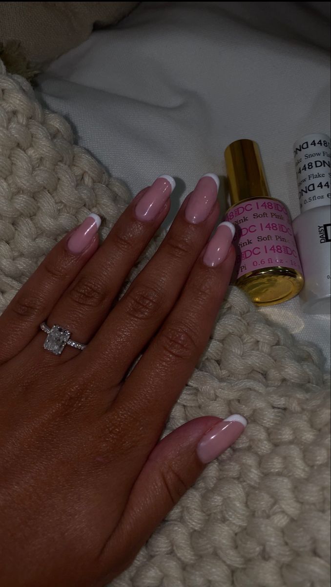 Sophisticated Elegant Nude Nails with Classic French Tips and Glossy Finish.