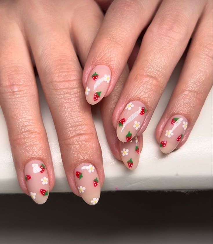 Whimsical Summer Nail Design with Floral and Fruity Accents.