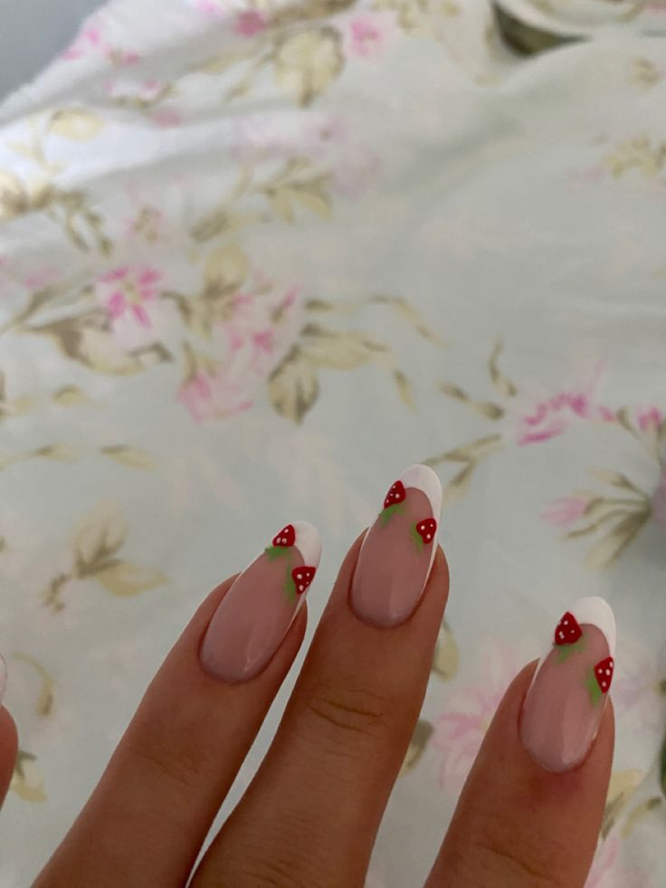 Playful Strawberry-Embellished Pink and White Nail Design for Spring/Summer Elegance.